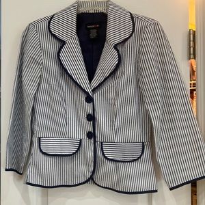 Two piece white/navy seersucker with navy binding at collar,front, skirt